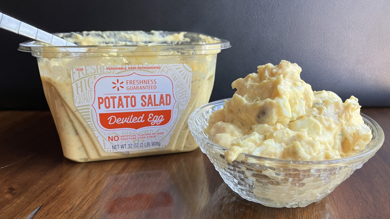 A tub and a bowl of Freshness Guaranteed Deviled Egg Potato Salad