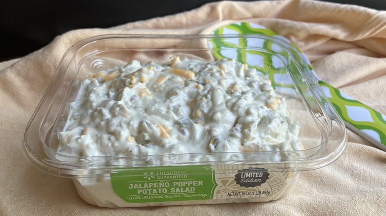 A plastic container of Freshness Guaranteed Jalapeño Popper Potato Salad