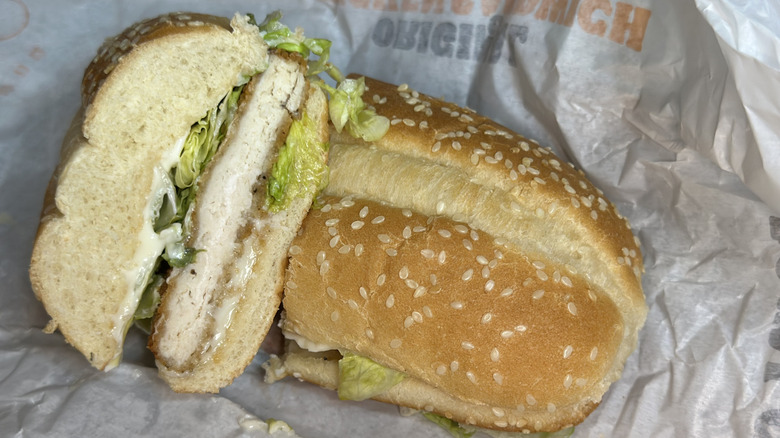 Burger King Original Chicken cut in half on wax wrapper