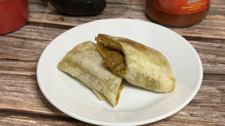 José Olé Beef & Cheese Burrito cut open on wooden platform