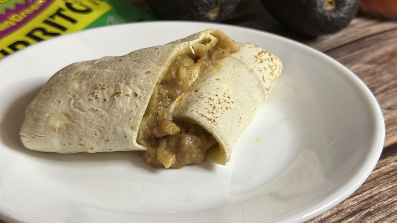 Tina's Beef & Bean/Green Chili cut open on a white plate