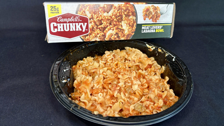 Chunky Meat Lovers' Lasagna frozen bowl microwave meal with box behind