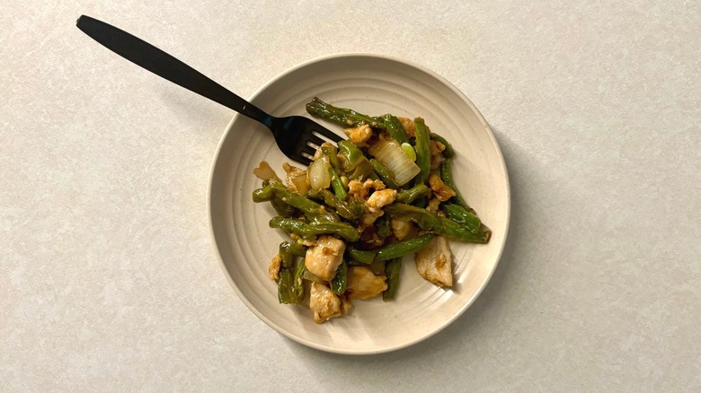Panda Express String Bean Chicken on plate with fork
