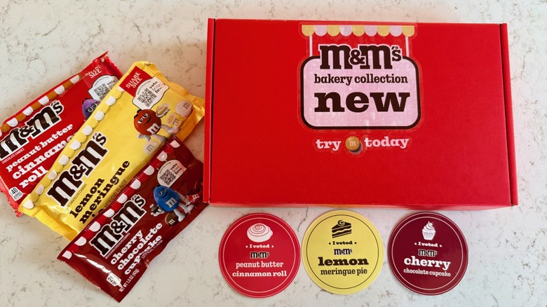 Bags of M&M's bakery collection chocolate candies and I voted stickers