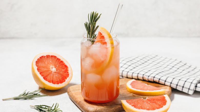 Paloma cocktail with fresh grapefruit and rosemary garnish