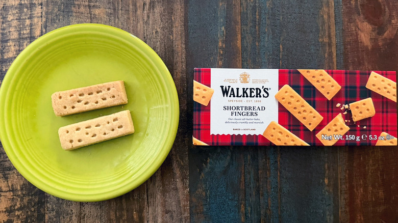 A plate of walker's shortbread biscuits next to the package