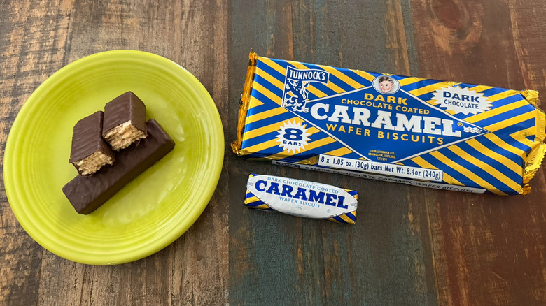 A plate of Tunnock's Dark Chocolate Caramel Wafer biscuits next to the package