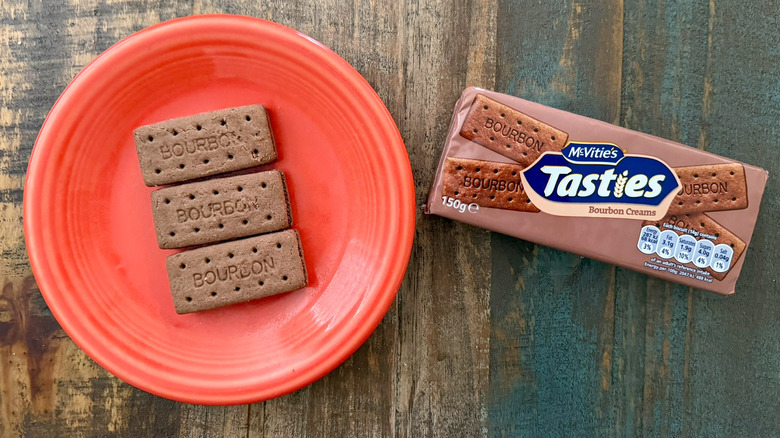 A plate of McVitie's Tasties bourbon cream biscuits next to the package