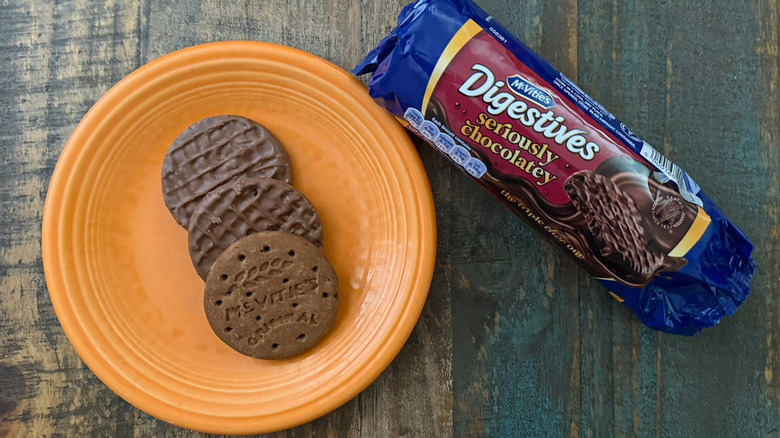 A plate of McVitie's Seriously Chocolatey biscuits next to the package