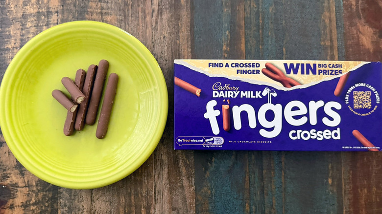 A plate of Cadbury chocolate finger biscuits next to the package