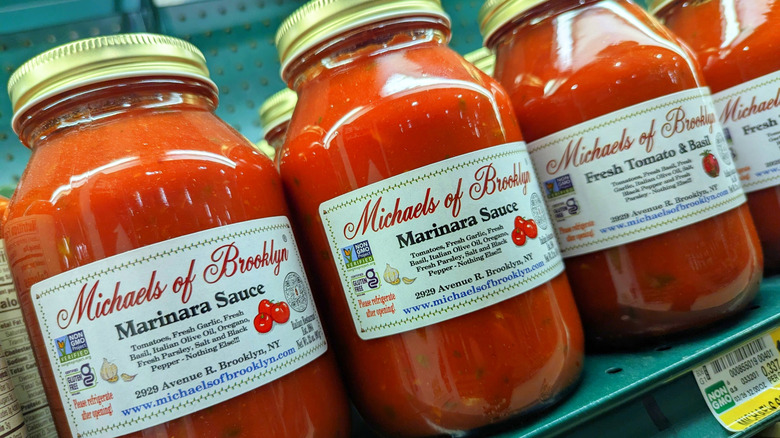 Candid diagonal shot of of Michaels of Brooklyn jarred pasta sauce on shelf