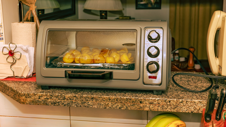 Potatoes cooking in a toaster oven
