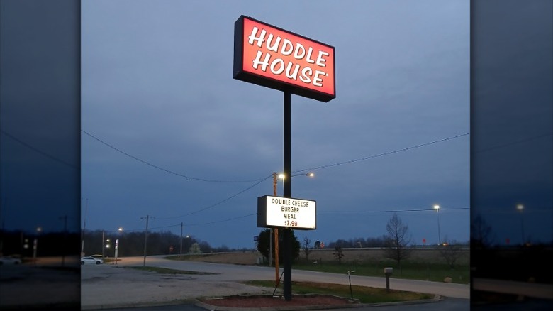 Illuminated roadside sign for Huddle House
