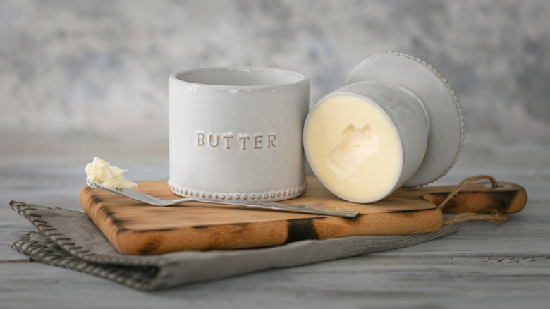 A gray French butter bell on a cutting board