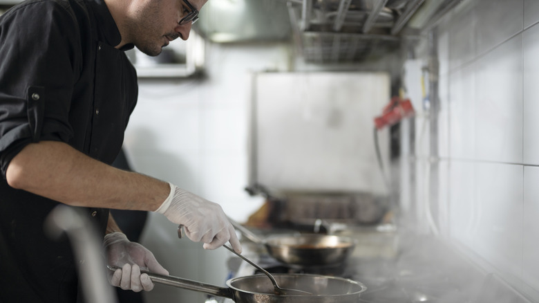 A chef preparing food.