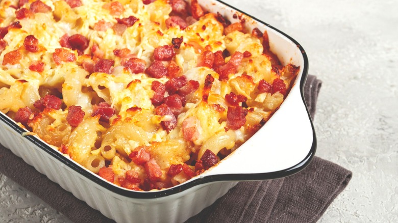 Baked macaroni and cheese with bacon in a casserole dish