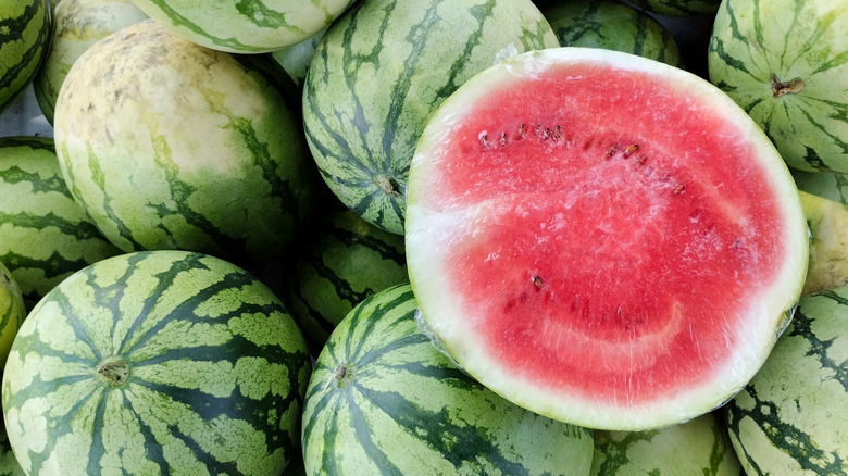 Whole and halved watermelons