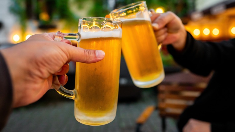 Beer glass clinking together