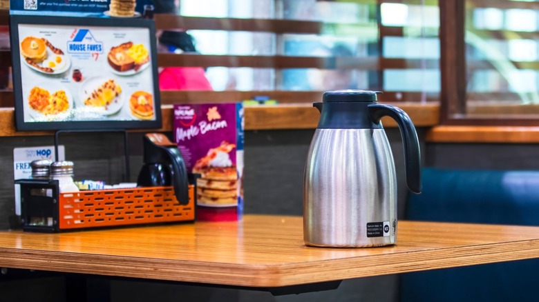 Coffee carafe on a table at IHOP.