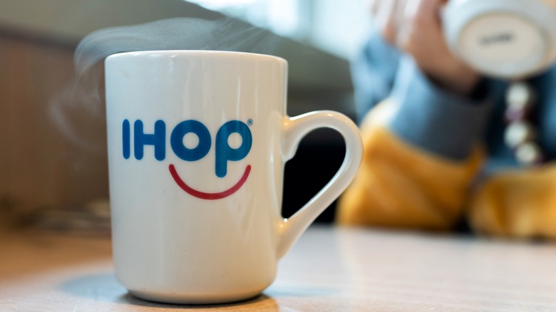IHOP coffee mug with steam rising out of the top.