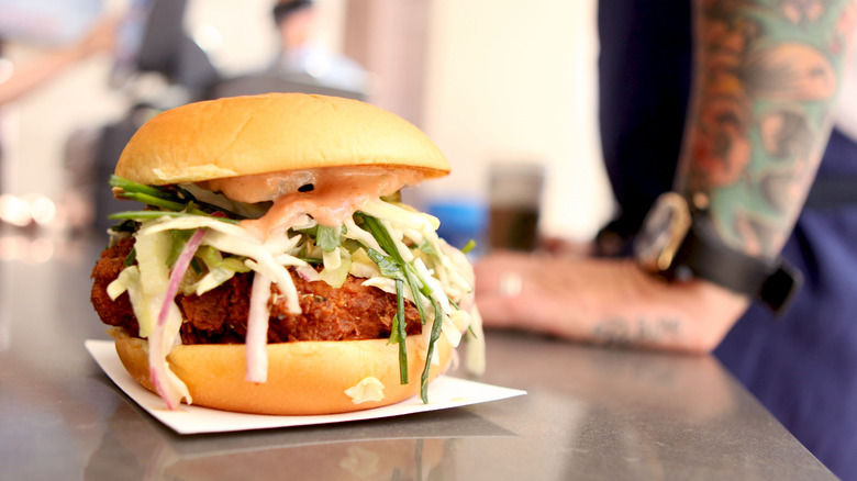 Fried chicken sandwich with cabbage slaw and jalapeños