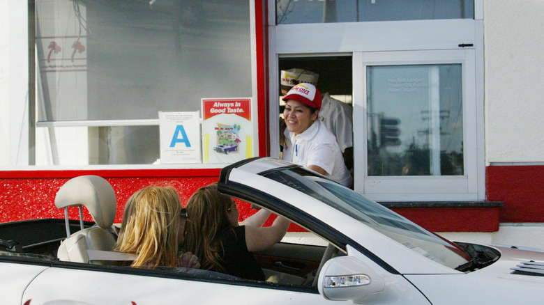 Customers at an In-N-Out drive thru.