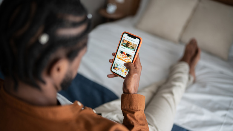A customer orders food from a phone.