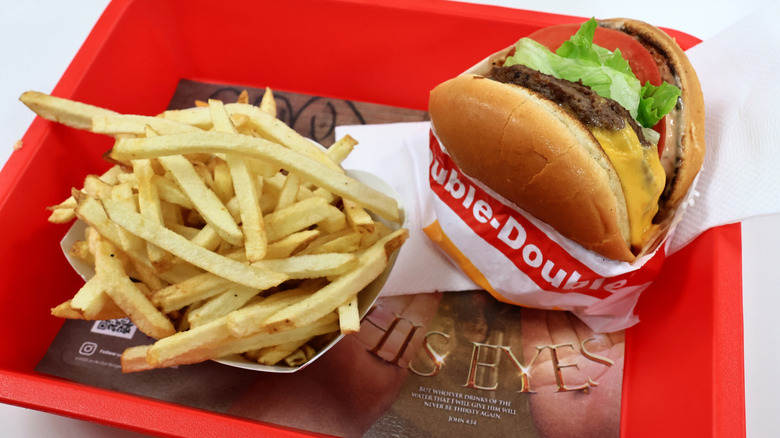 In-N-Out Double-Double Burger and fries served on a tray.