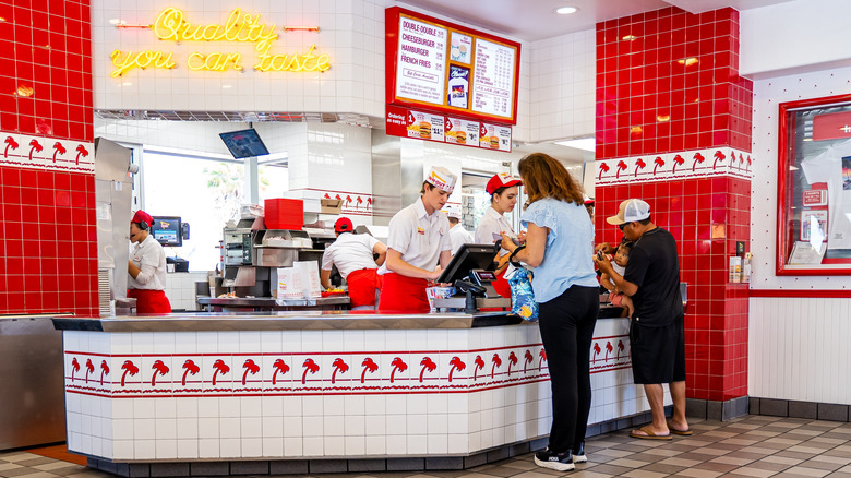 People ordering at the counter at In-N-Out restaurant