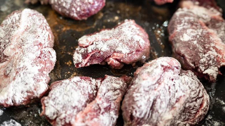 Pieces of beef coated in flour