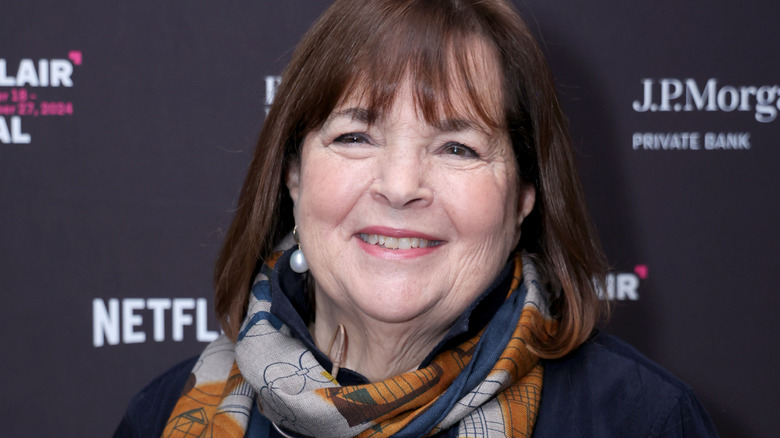 Ina Garten smiles in a scarf at an industry event