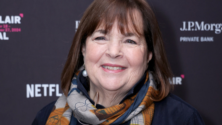 Ina Garten smiles in a blue and yellow scarf at an event