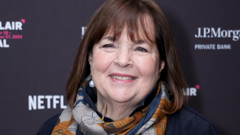 Ina Garten smiling in a scarf and blue jacket