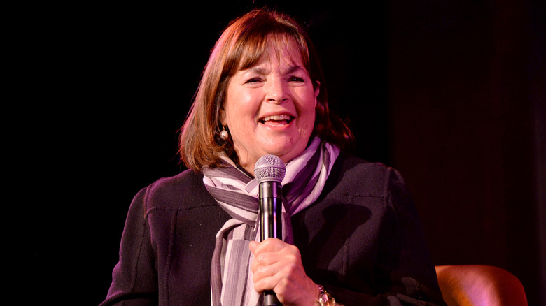 Ina Garten smiles with microphone in hand