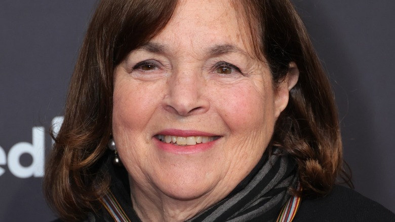 Ina Garten smiles in a striped scarf at an event