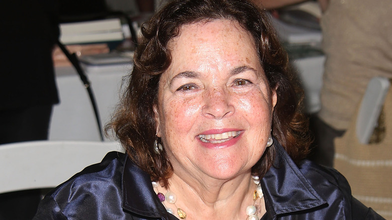 Ina Garten sitting and grinning