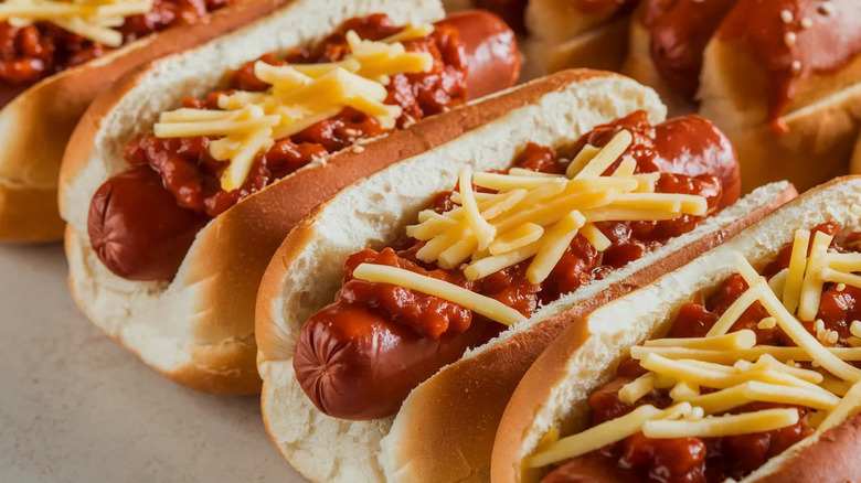 chili dogs topped with shredded cheese