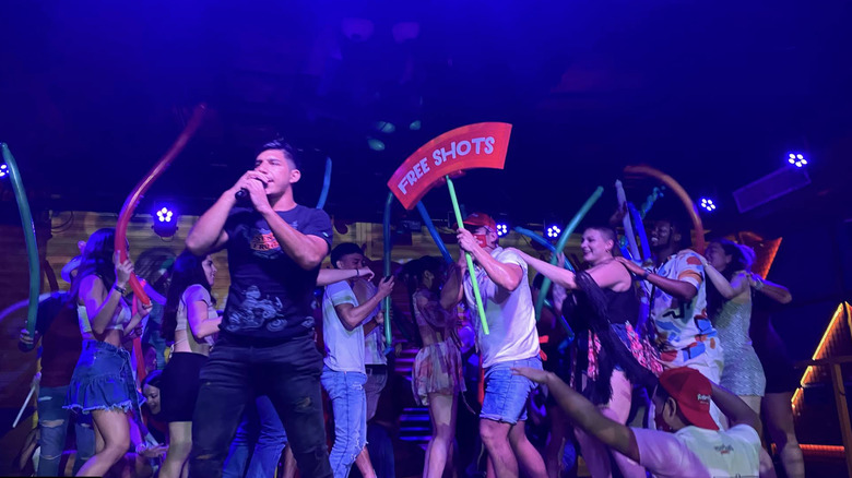 People dancing in a conga line at Señor Frog's in Cancun