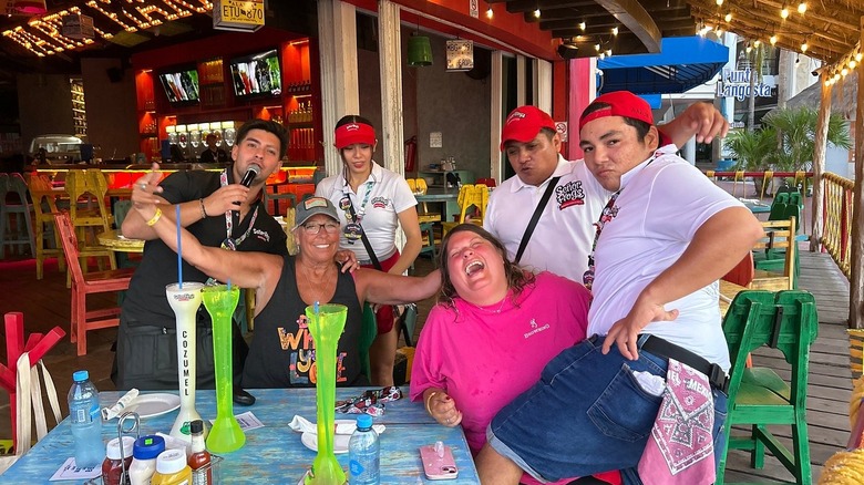 Waiters making patrons laugh