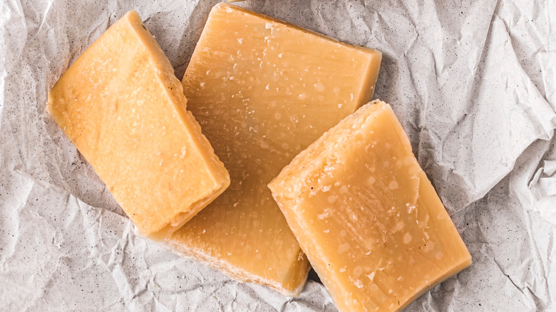Three parmesan rinds on cheese paper