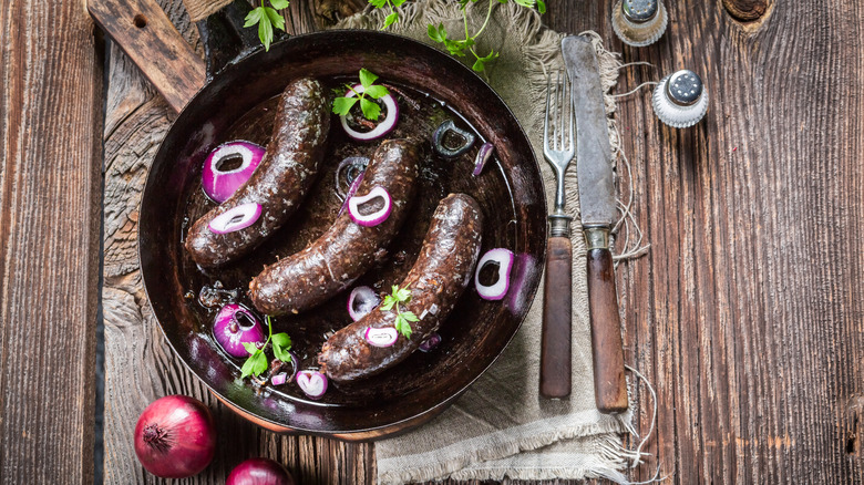 Black pudding sausages in pan