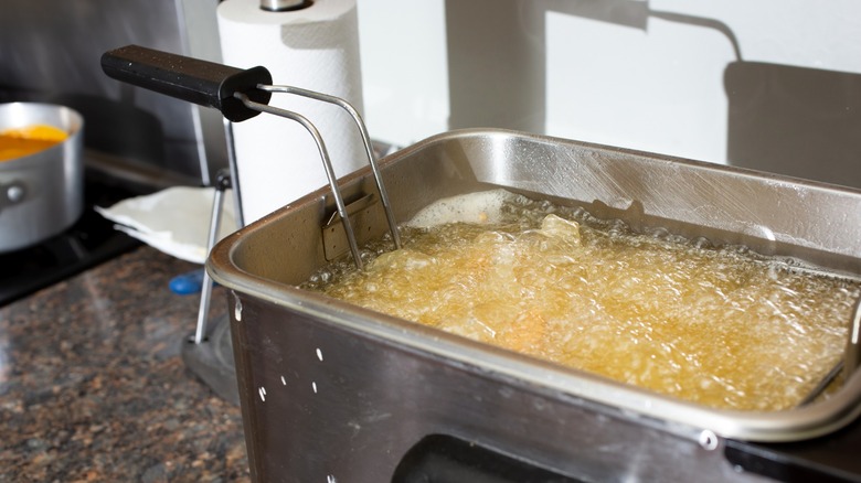Countertop deep fryer bubbling with oil
