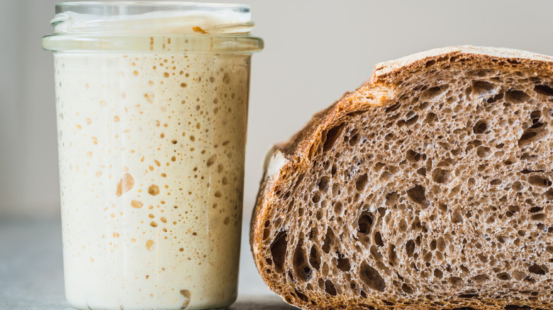 A loaf of sourdough bread with starter.