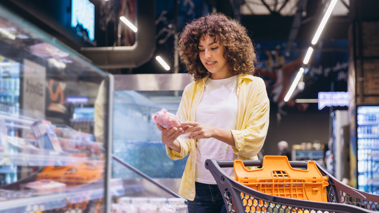 Woman shopping for meat