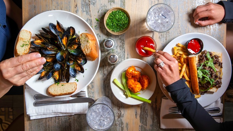 Top-down view of two people eating at restaurant