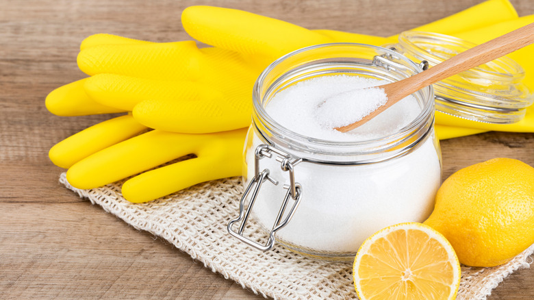 Citric acid in a jar, sitting on a table.