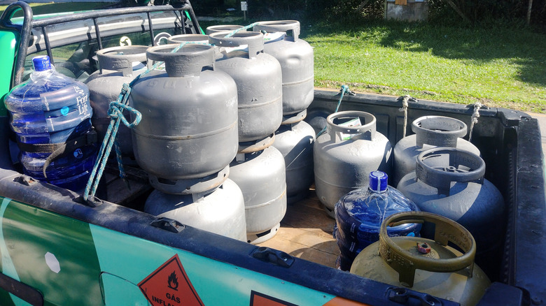 Propane tanks safely stored in the back of a delivery truck in Brazil