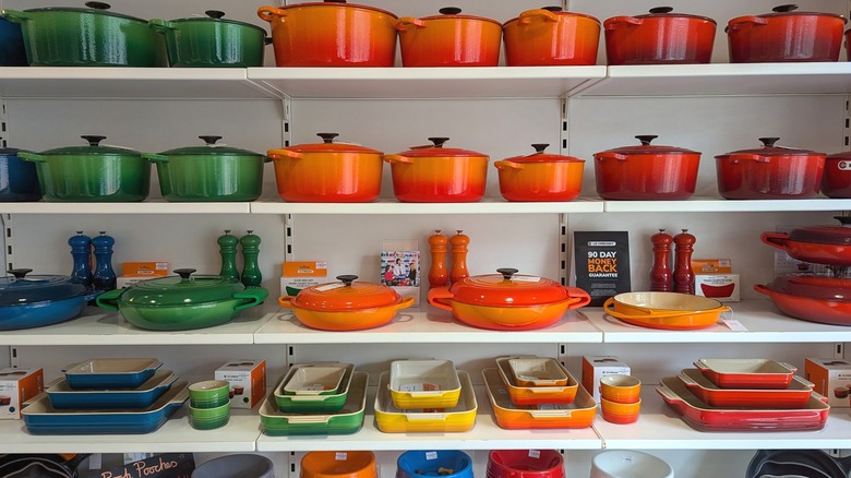 Le Creuset cookware on store shelves