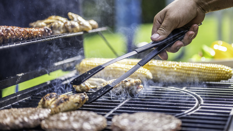 Chicken wings and corn on the grill