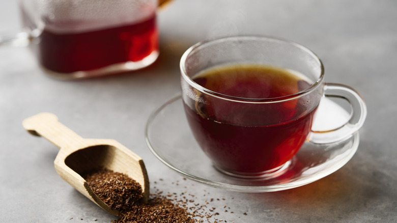 glass tea cup filled with red rooibos tea